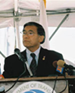 U.S. Secretary of Transportation Norman Y. Mineta speaking at the podium.